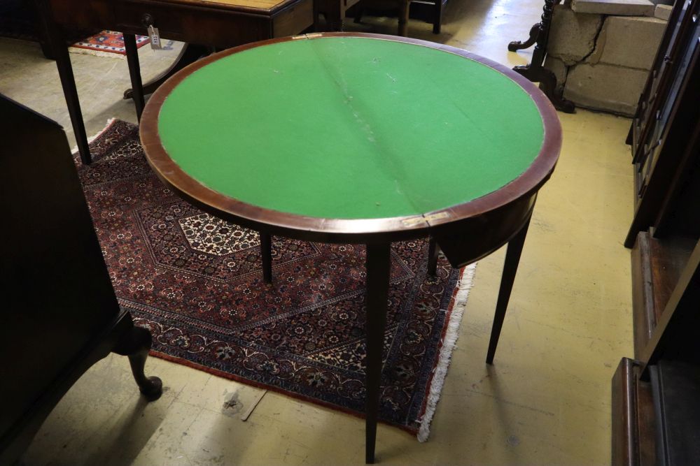 A George III style mahogany demi lune card table, width 86cm, depth 43cm, height 76cm